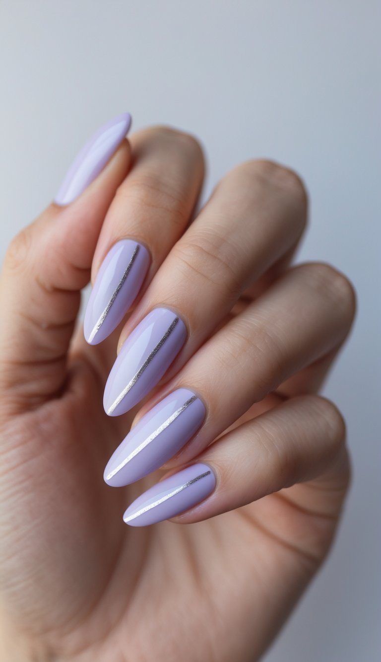 Close-up of one hand showing light purple nails with silver diagonal lines on a white background.