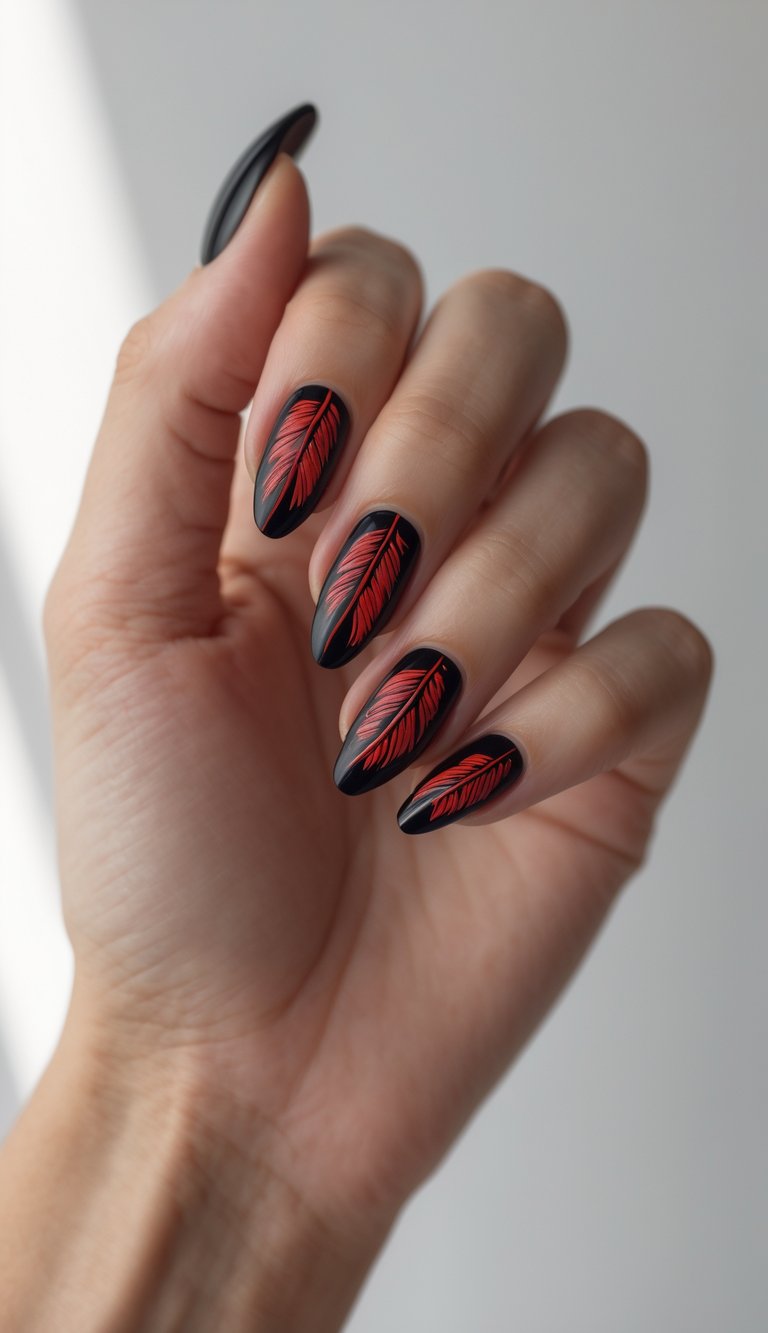 Close-up of one hand with black nails and red feather designs on a white background.