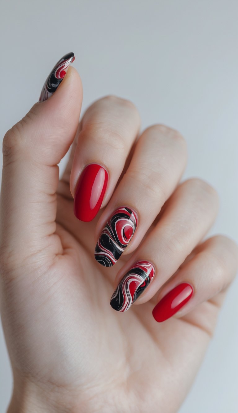 Close-up of one hand with red nails featuring black marble swirl designs on a white background.