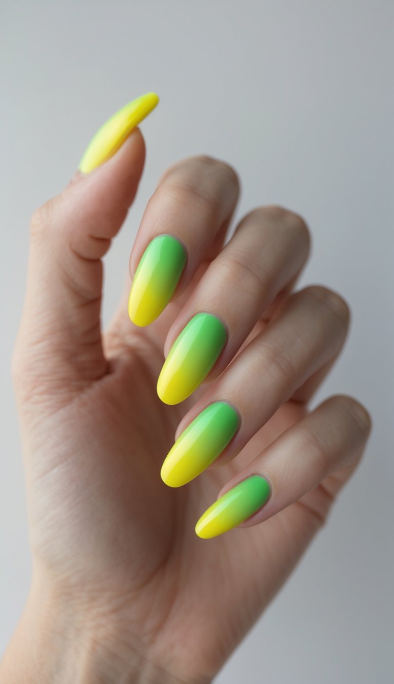 Close-up of one hand with neon green to yellow ombre nails against a white background.