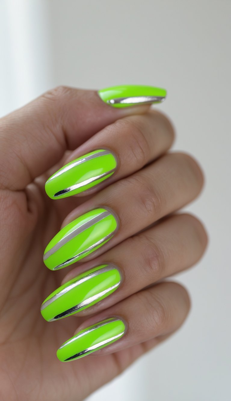 Close-up of one hand showing neon green nails with shiny silver stripes on a white background.