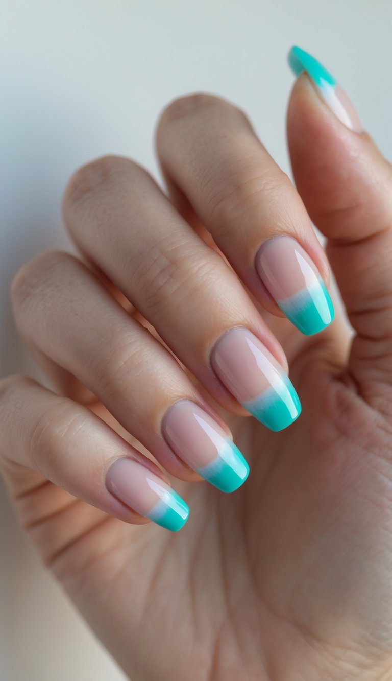 Close-up of one hand with nails painted in aqua French tips on a clear base against a white background.