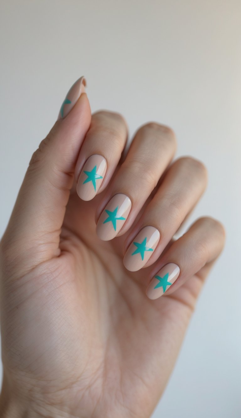 Close-up of one hand with nude nails decorated with small aqua star designs against a white background.