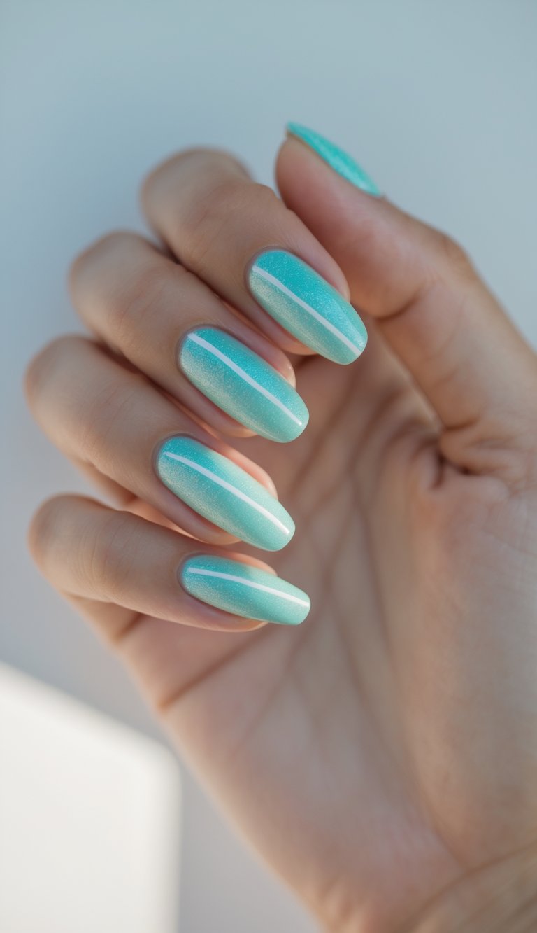 Close-up of one hand with turquoise pearlescent nails featuring simple white line designs on a white background.