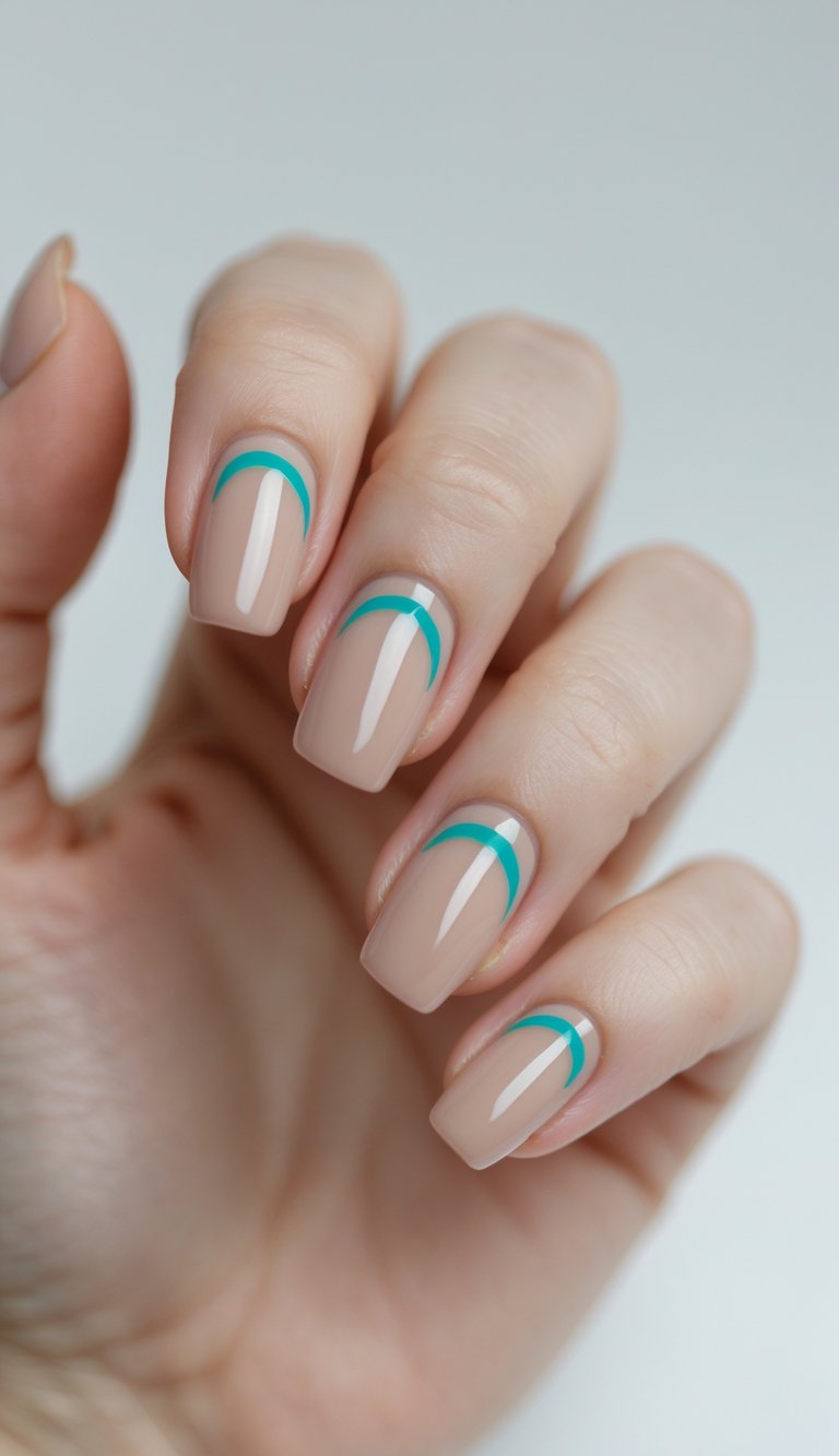 Close-up of one hand showing nails painted with sheer nude polish and small turquoise crescent designs near the cuticles against a white background.