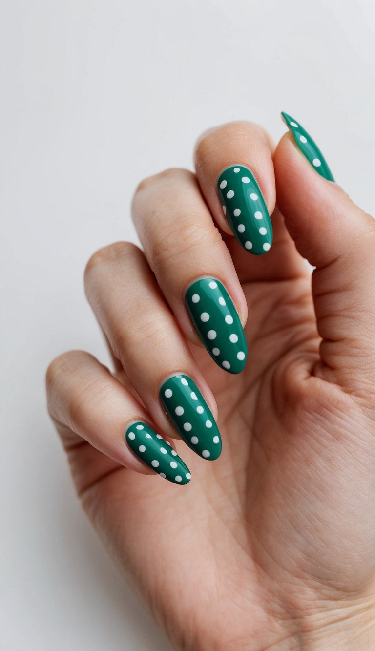 A close-up of emerald green nails with polka dot designs
