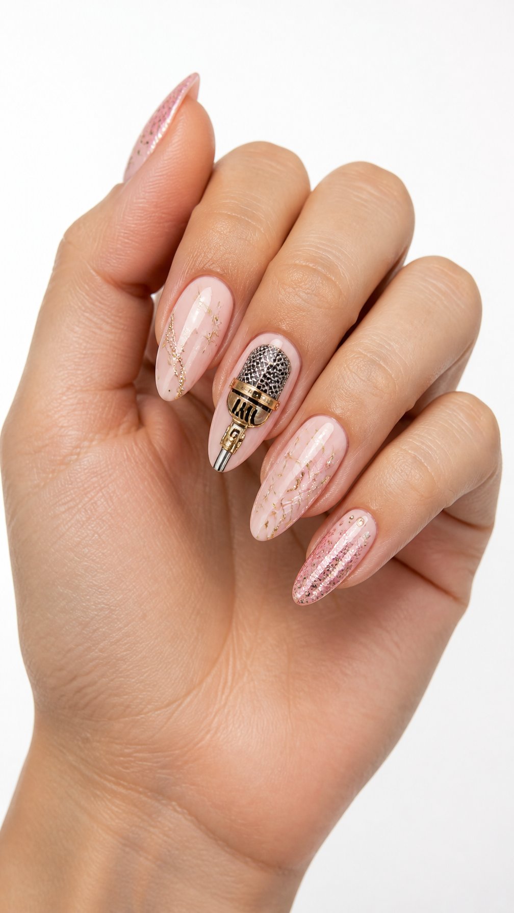 A single hand with glossy nude-pink nails featuring a detailed silver microphone accent nail and subtle sparkle.